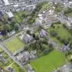 Oblique aerial view of Newton Stewart, centred on Penninghame Parish Church, taken from the WNW.