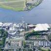 General oblique aerial view of Alloa Gasworks with glasshouse adjacent, taken from the NNE.