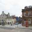 Street view looking towards Bo'ness Market Square taken from the North. The image shows 2 Market Street and 72-74 North Street and the Jubilee Fountain can be seen within the square. This photograph was taken as part of the Bo'ness Urban Survey to illustrate the character of the Town Centre Area of Townscape Character.