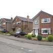 Street view showing 2-8 Woodlands Drive, Bo'ness, taken from the North-East. This photograph was taken as part of the Bo'ness Urban Survey to illustrate the character of the Kinneil Area of Townscape Character.