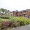 Street view showing detached housing at Blair Avenue, Bo'ness, taken across the central green space. This photograph was taken as part of the Bo'ness Urban Survey to illustrate the character of the Kinneil Area of Townscape Character.