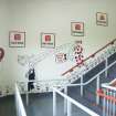 Interior. View of main supporters' staircase within Richard Donald stand, showing graffiti by local cartoonist.