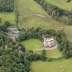 Oblique aerial view of Caprington Castle and stables, taken from the ESE.