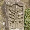 Detail of carved stone fragment set into wall adjacent to gate in garden to south of house.