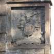 Detail of carved panel with coat of arms on south gate pillar.