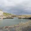 General view looking across Keiss inner harbour to the warehouse, taken from SW