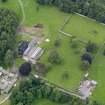 Oblique aerial view of Jardine Hall stables and walled garden, taken from the NE.