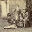 View of three ladies with dogs outside St Fort House.
