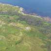 General oblique aerial view of remains of fort and duns at Dun Skeig, taken from the ESE.