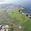 General oblique aerial view of Royal Tarlair Golf Course, taken from the ESE.