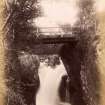 View of waterfall and footbridge.
Titled: 'Lower Falls, Glen Nevis.'