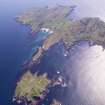 General oblique aerial view of the Island of Muck with Eilean nan Each in the foreground, taken from the WNW.