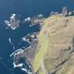 Geeral oblique view of the W end of Canna centred on the fort of Dun Channa, taken fromt he S.