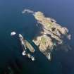 Oblique aerial view of Oigh-Skeir and the Hyskier lighthouse, taken from the SW.