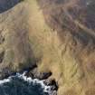 Oblique aerial view of the remains of a field system, field boundaries, and lazy beds at Mullach A' Lusgan, Berneray, taken from the ESE.