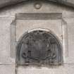 Main southeast entrance, detail of coat of arms in panel above door