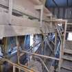 Interior. Crusher House. Conveyors 1 and 2. Electromagnet suspended above lower conveyor