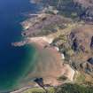 General oblique aerial view looking along the shore at the south end of Gruinard Bay with Gruinard House in the distance, taken from the SW.