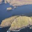 General oblique aerial view of  the remains of  Dun Briste and Sron an Duin, near Barra Head lighthouse overlooking the sea cliffs of Berneray, taken from the S.