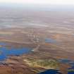 General oblique aerial view of the Lochs wind farm at Loch a' Bhlar Bhuidhe and the remains of peat cutting at Loch Lobhair, Lochs, Lewis, taken from the SSE.