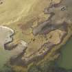 Oblique aerial view of the remains of a system of fish traps at Oronsay, North Uist, taken from the SW.