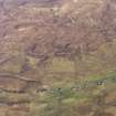 General oblique aerial view of the remains of the eastern end of Trumpan Mor and the western end of the townships of Upper and Lower Halistra, with the remains of adjacent dykes, enclosures and lazy beds, Waternish, Skye, taken from the SW.