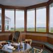 Interior.  View from within the bay window of the mens locker room of Muirfield clubhouse, looking out to the course.