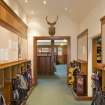 Interior. View looking along passage leading to mens locker room.