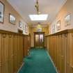 Interior.  Ground floor.  View looking along corridor linking the locker room area and the social spaces of the clubhouse.