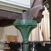 Interior. Detail of cast iron column head supporting roof truss.