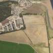 Oblique aerial view of the soilmarks of the rig and furrow at Edzell Airfield, taken from the SE.