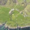 General oblique aerial view of chapel and burial ground at Nereabolls, Islay, taken from the SE.