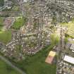 General oblique aerial view of Cumnock centred on the site of the former railway station, taken from the S.