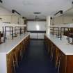 Interior. View along workstations to whiteboard within teaching laboratory