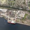 General oblique aerial view of Caledon East Wharf at Stannergate, Dundee, taken from the SSE.