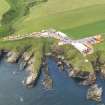 General oblique aerial view of the survival craft inspectorate yard and the site of St Ternan's Chapel and Well, taken from the ESE.