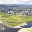 General oblique aerial view of Kings Links Golf Course with tower blocks adjacent, taken from the NE.