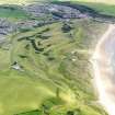 General oblique aerial view of Cruden Bay Golf Course, taken from the SW.