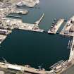Oblique aerial view of HM Dockyard main basin Rosyth, taken from the W.