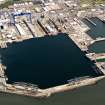 Oblique aerial view of HM Dockyard main basin Rosyth, taken from the SW.