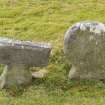 Detail of Round headed and T shaped stones within the burial ground to the south east of church