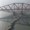 Oblique aerial view of one of the spans of the Forth Rail Bridge with Inch Garvie in the foreground, looking WSW.