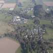 Oblique aerial view of Forgandenny Parish Church and Strathallan School, looking E.