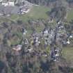Oblique aerial view of Forgandenny Parish Church and village with Strathallan School beyond, looking E.