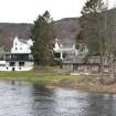 General view taken from Kenmore Bridge, looking east to the rear of Kenmore village, showing (from left) the reading rooms (with hotel stables to fore), the Kenmore Hotel, the boathouse and boathouse cottage.