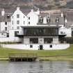 View from the north bank of the River Tay, looking south to the rear elevations and modern extension to the Kenmore Hotel.