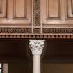 Interior. Detail of column capital and decoration on balcony front
