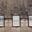 Detail of three dormer windows with carved stone pediments on west facade, Ardkinglas House.