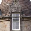 Detail of central dormer window with carved stone pediment at 2nd floor level of south facade