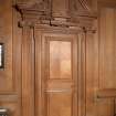 Interior. 1st floor, saloon, view of door with carved pediment